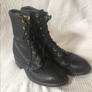 Black tight fitted lace up combat riding boots